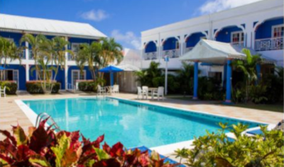 Poolside view of a hotel that is part of Bay Gardens Resorts, St. Lucia.