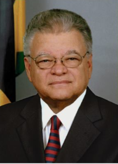 Portrait view of the Honorable Karl Samuda, Minister to the Ministry of Industry, Commerce, Agriculture and Fisheries Jamaica.