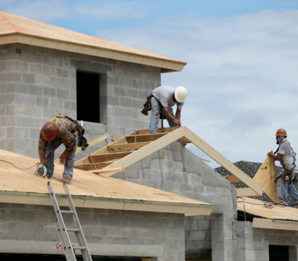 Example of workers installing wooden roofing framing for hardware lumber ltd.