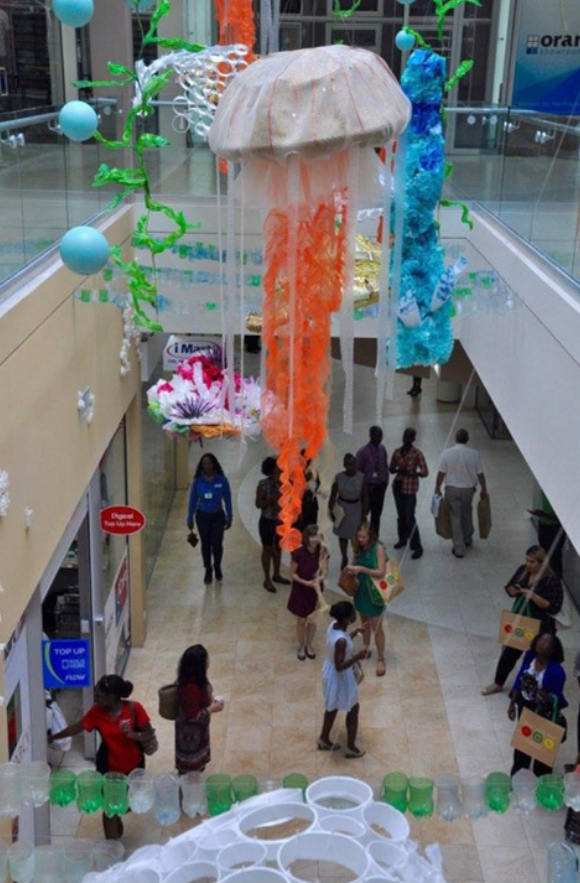 A second story view of a handing underwater display art at the Sheraton Mall.