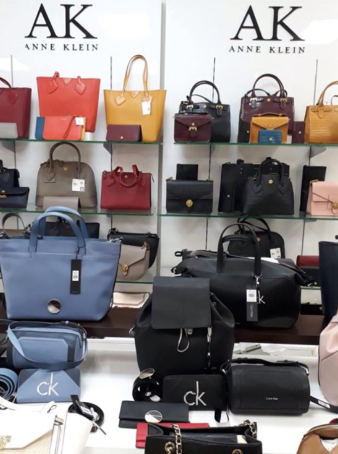 An assortment of Anne Klein handbags on display at a store in the Sheraton Mall mall.