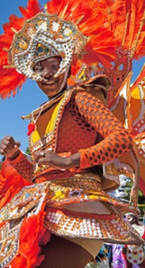 Bahamas Mortgage Corporation. A dancer dressed up in a colorful costume.