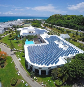 Sofos Jamaica. Aerial view of a large building with solar panels.