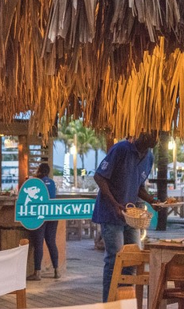 Ministry of Finance & Economic Development in the Cayman Islands. A man sitting down to eat.