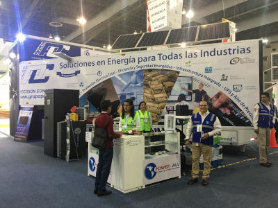 Grupo Precision Control at a conference with their booth set up and people present.