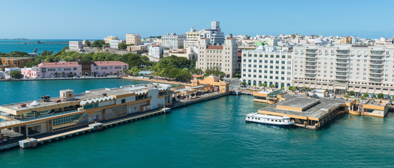 Property Management Inc. Puerto Rico. Harbour view with tall buildings in the background.