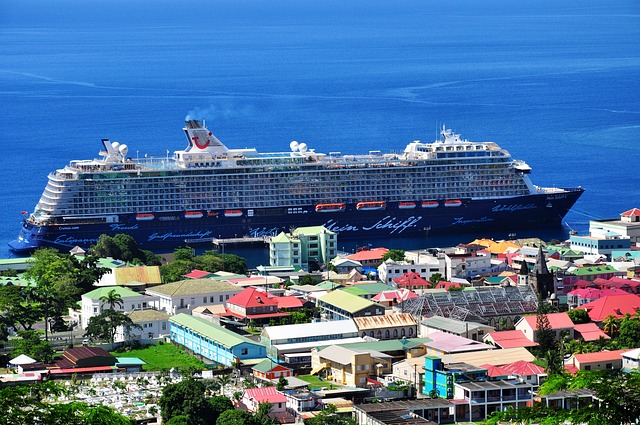 Ministry of Tourism & Investment, Antigua and Barbuda. A cruise ship on the edge of a town.