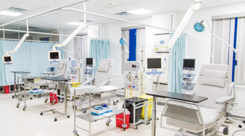 TCI Hospital - Turks and Caicos. A row of patient chairs and other equipment.