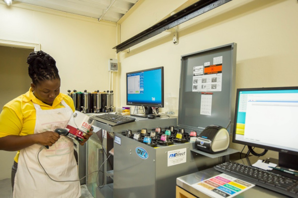 M.S. Osborne Ltd. employee at work using computerized equipment.