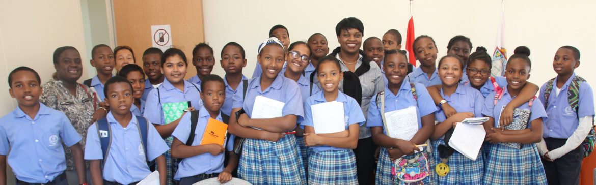 Prime Minister of St. Maarten, Leona Romeo-Marlin with school children.
