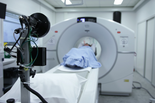 Falmouth Public General Hospital, stock image showing an MRI type scanning device with a patient inside.