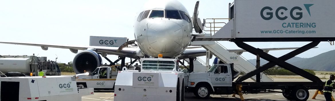GCG Ground Services plane with a myriad of gcg utility vehicles next to it servicing various aspects.