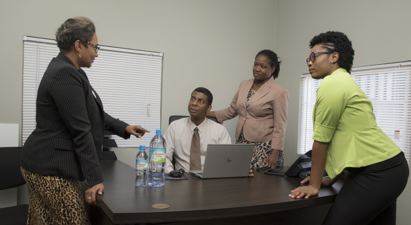 Lifespan Company Ltd group meeting with men and women around a desk.